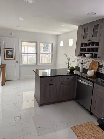 a kitchen with a sink and cabinets