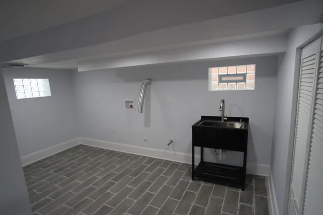 a bench sitting in a room next to a window