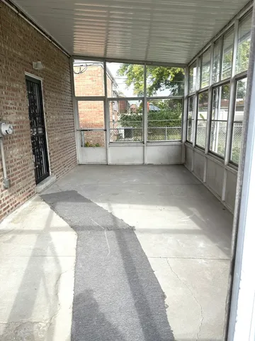 a view of an empty room with a balcony