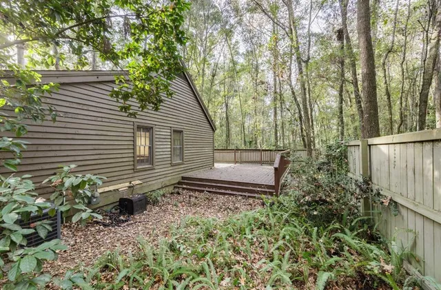 a backyard of a house with lots of green space