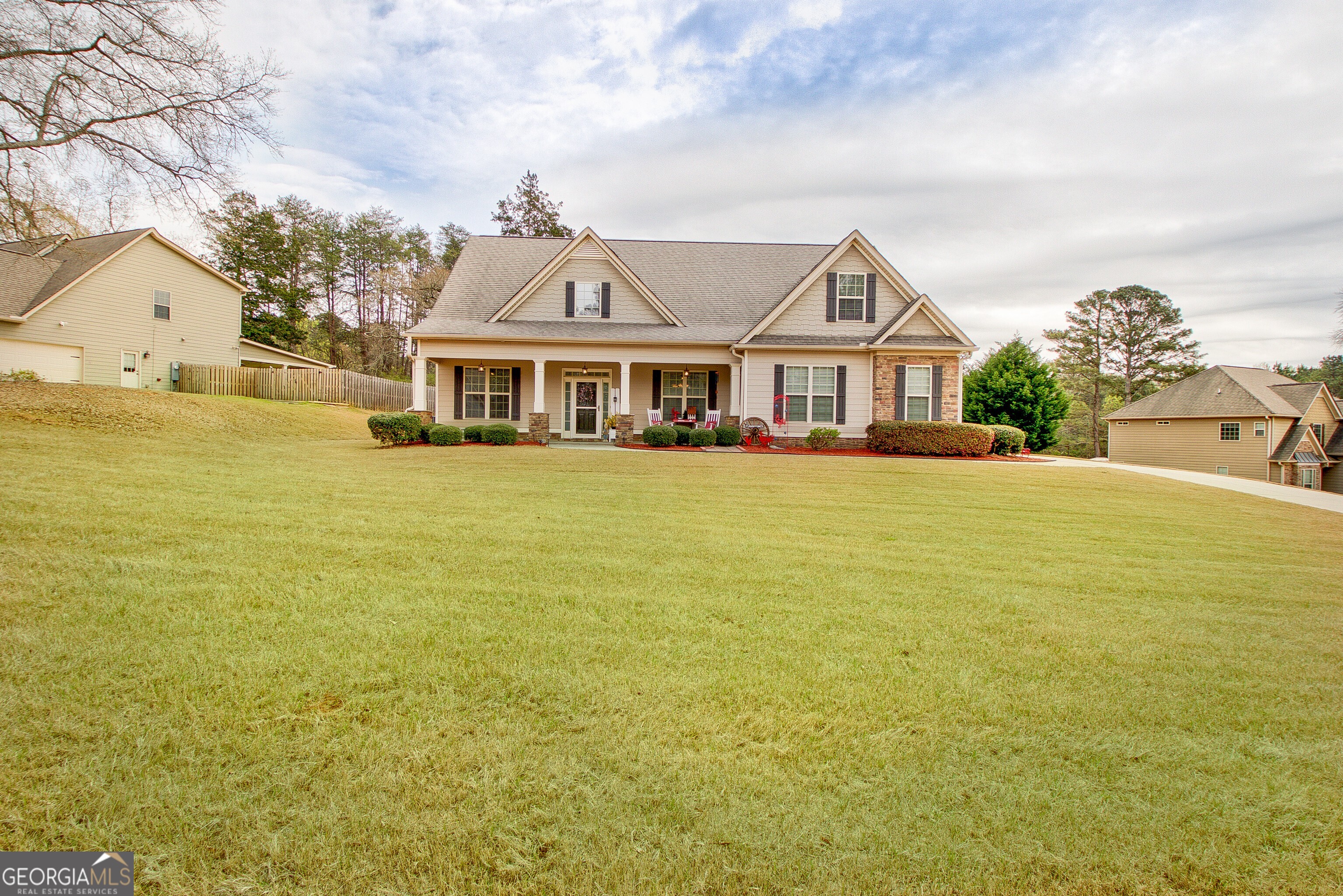 32 Austin Storey Circle Newnan, GA 30263 - Photo 20 of 84 a view of a house with a big yard and large trees