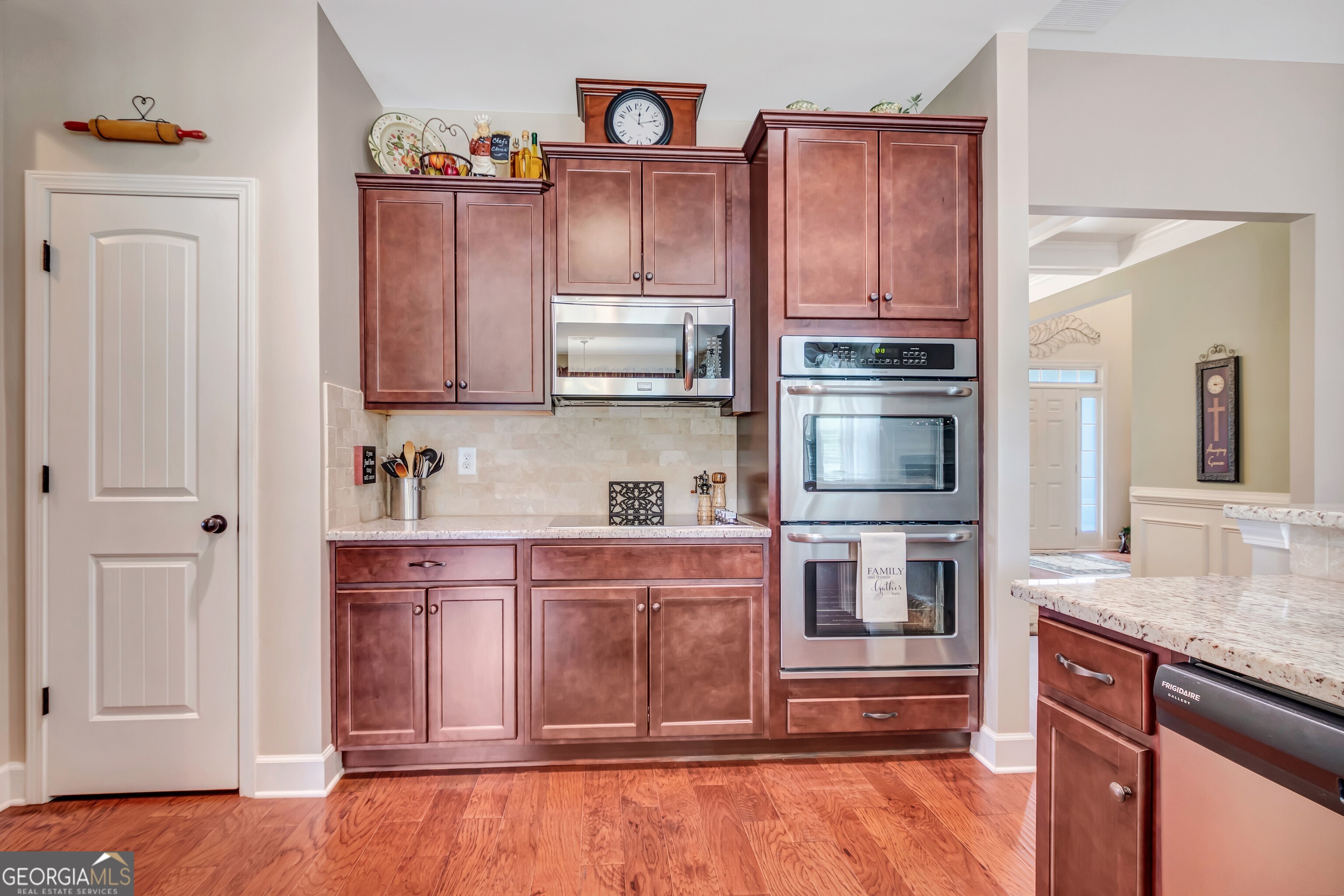 32 Austin Storey Circle Newnan, GA 30263 - Photo 26 of 84 a kitchen with stainless steel appliances granite countertop a refrigerator and cabinets