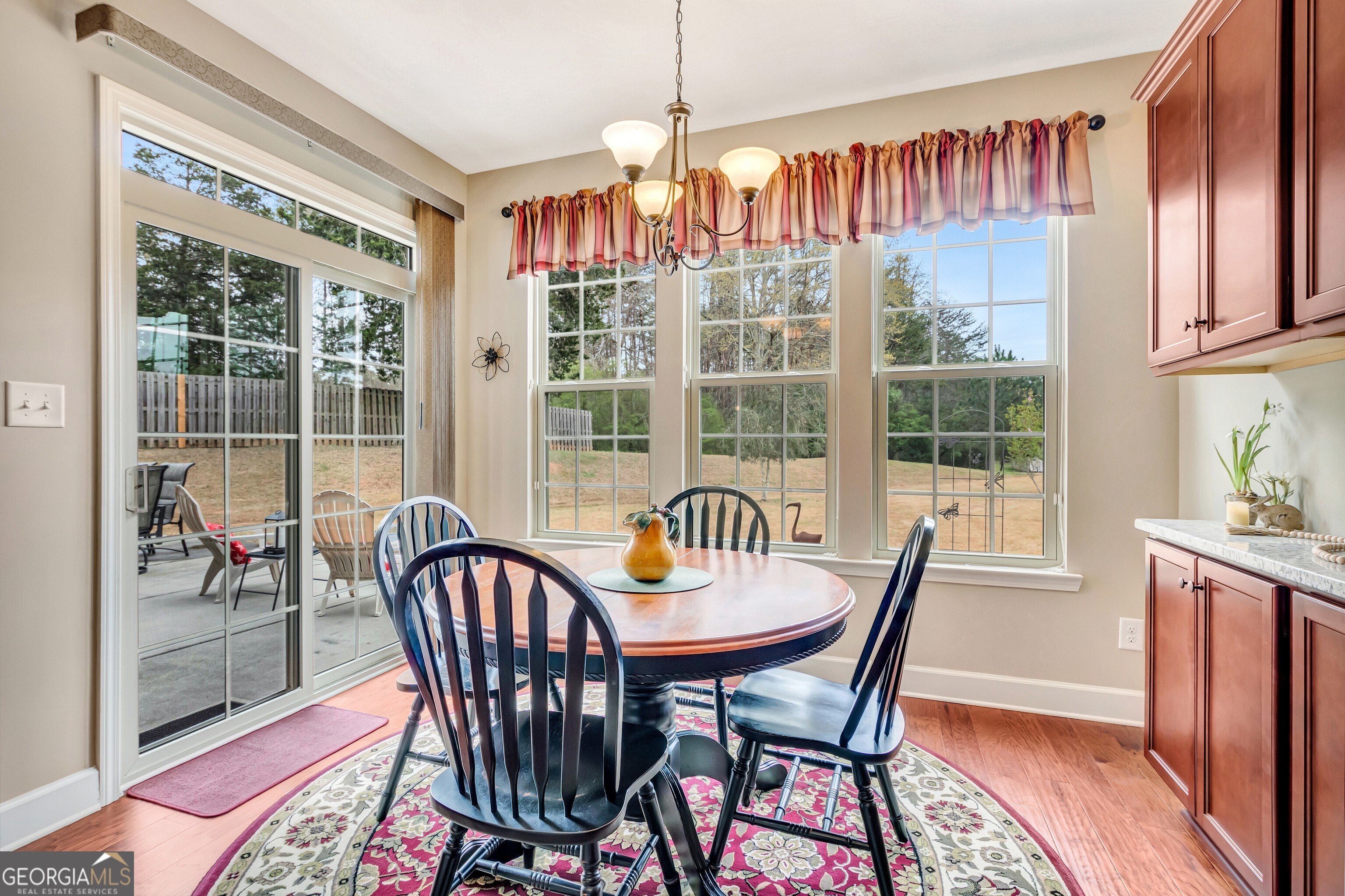32 Austin Storey Circle Newnan, GA 30263 - Photo 28 of 84 a dining room with furniture a chandelier and wooden floor