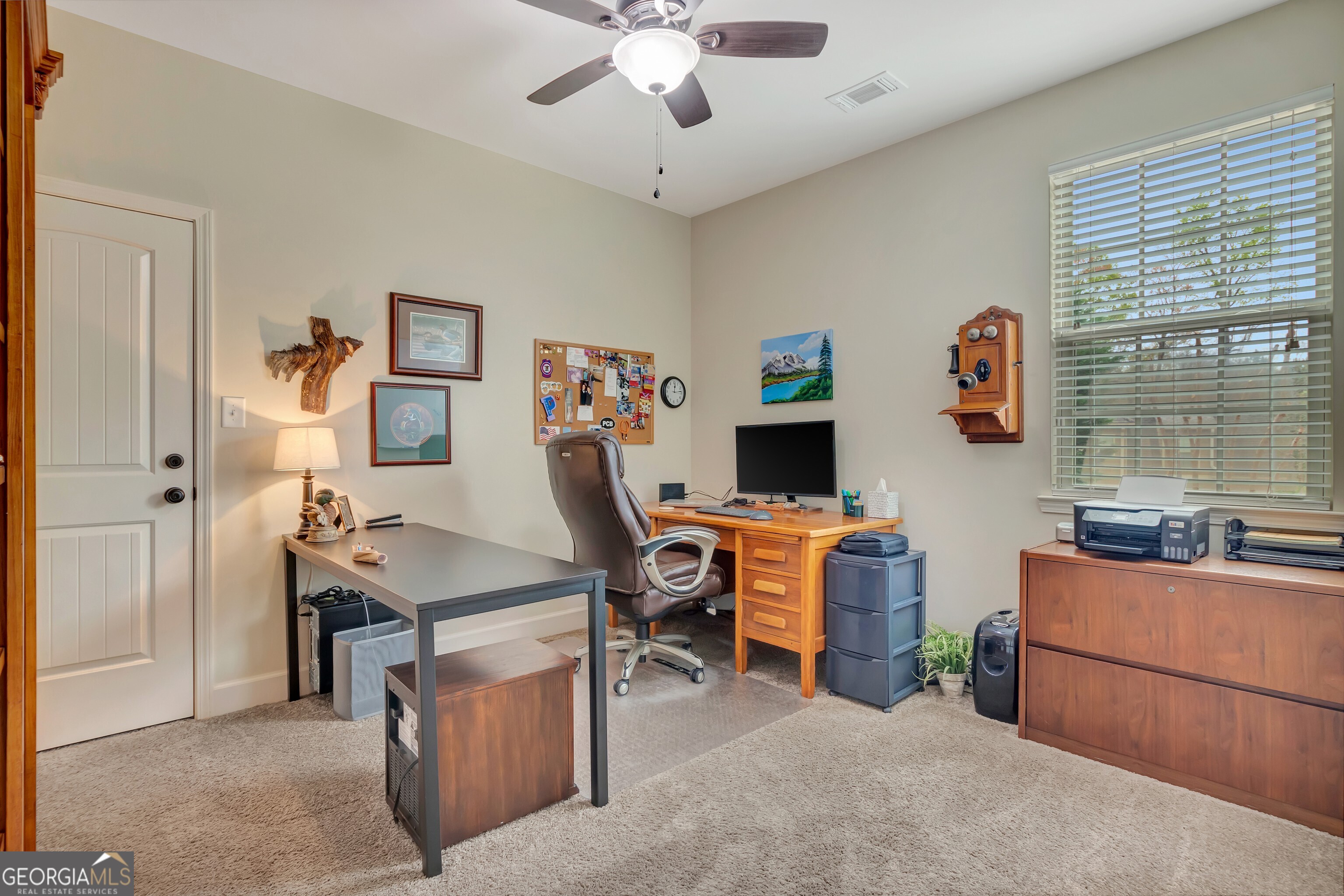 32 Austin Storey Circle Newnan, GA 30263 - Photo 39 of 84 a view of a workspace with furniture and a window