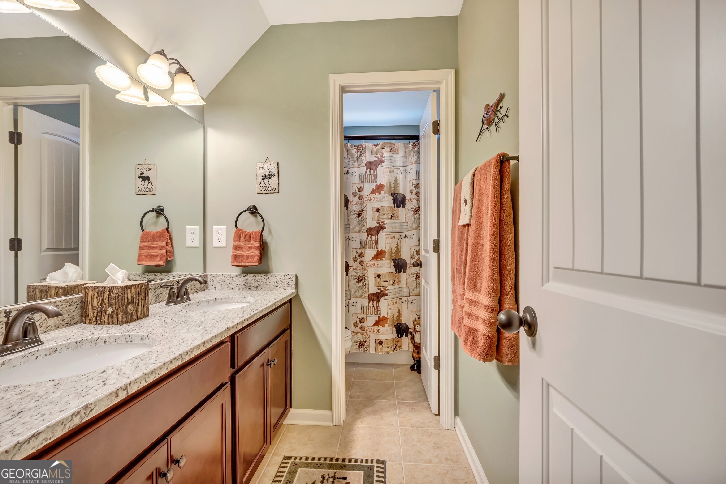 32 Austin Storey Circle Newnan, GA 30263 - Photo 54 of 84 a bathroom with a granite countertop sink and a mirror