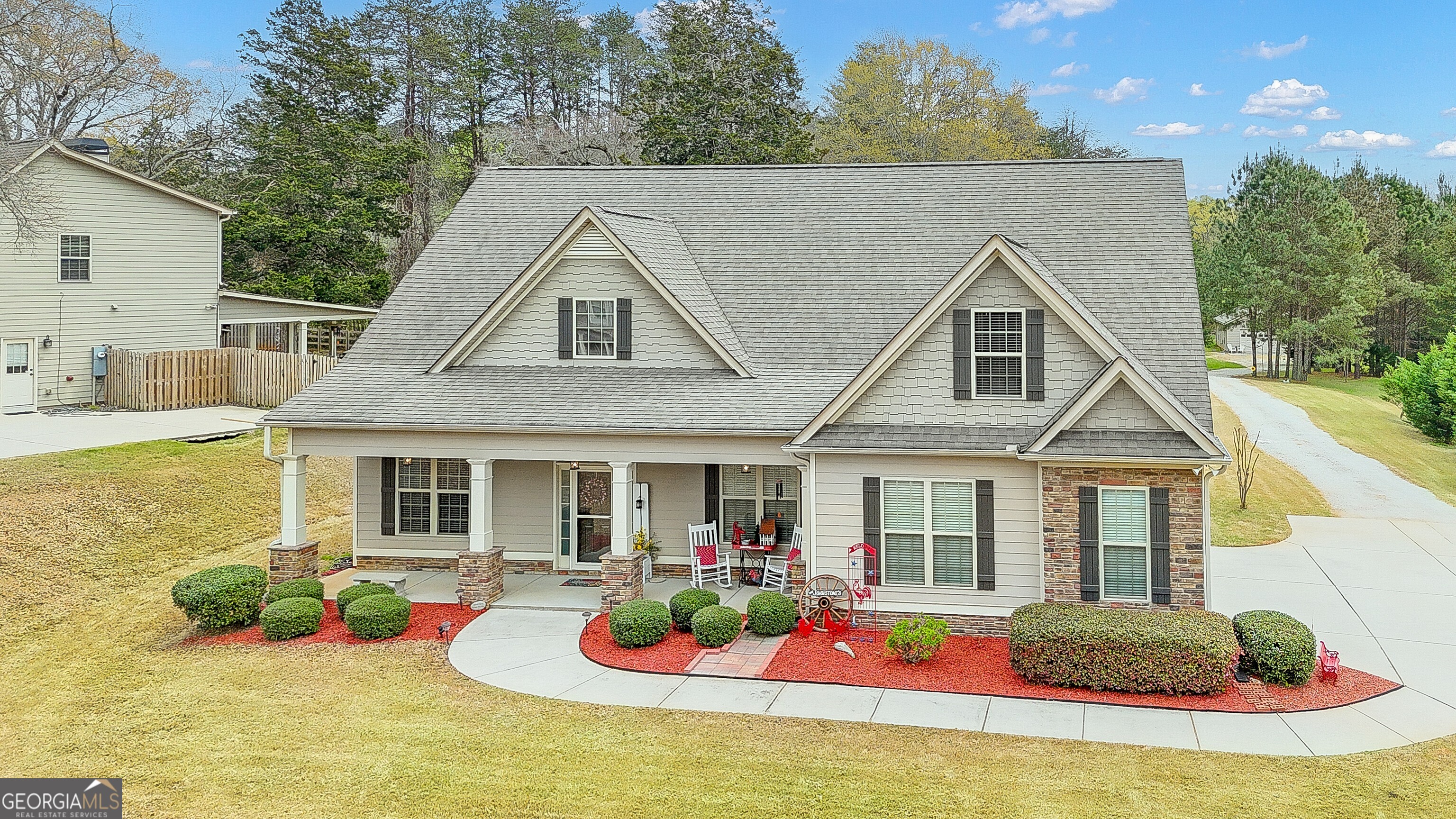 32 Austin Storey Circle Newnan, GA 30263 - Photo 6 of 84 a front view of a house with yard furniture and garden