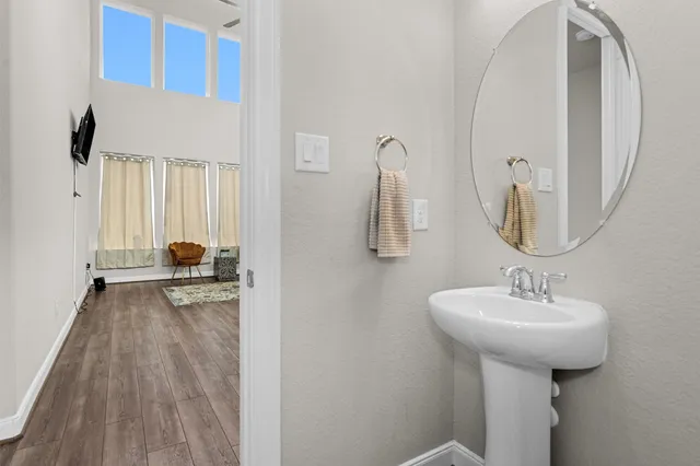 a dining room with furniture and wooden floor