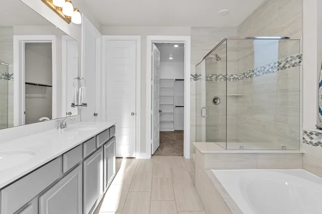 a bathroom with a bathtub and shower