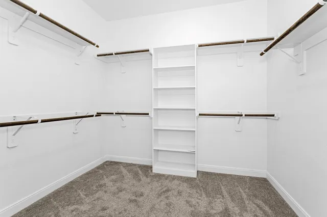 a view of a hallway with stairs