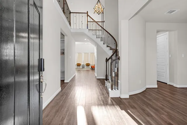 a view of hallway with wooden floor