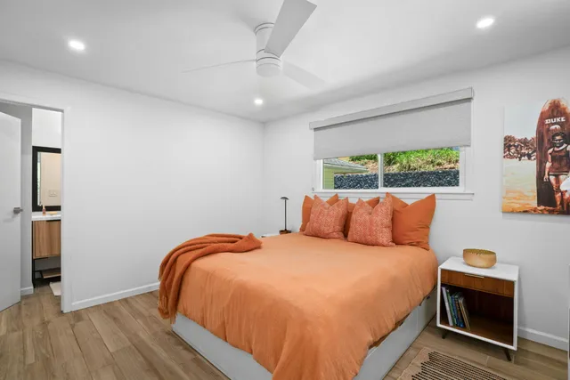 a bedroom with a bed and a view of bedroom