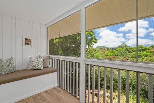a view of a two chairs in the balcony