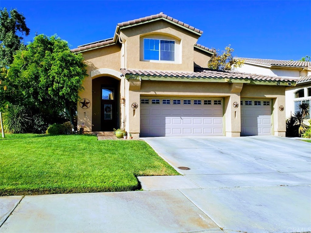 20852 Golden Rain Road Riverside, CA 92508 - Photo 1 of 1 a front view of a house with a garden
