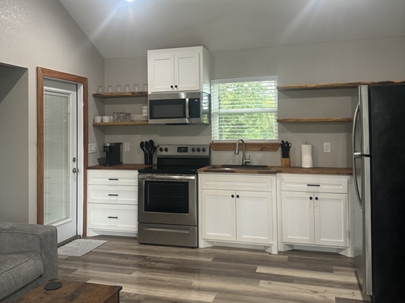 4326 Highway 19 Trinity, TX 75862 - Photo 9 of 12 a kitchen with appliances cabinets and a window