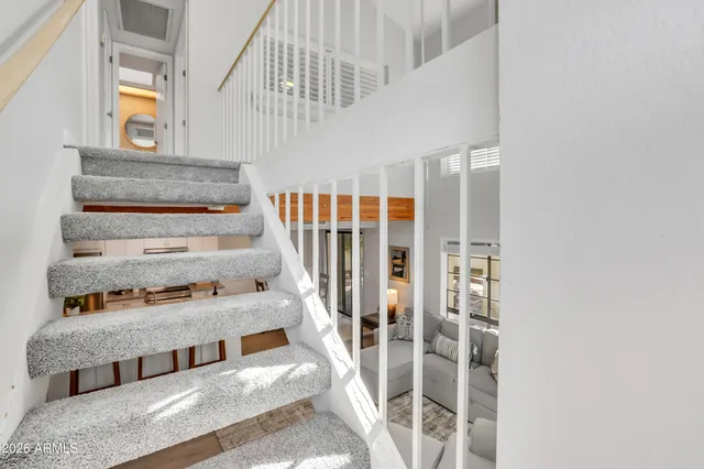 a living room with furniture and a rug
