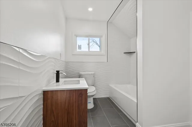 a bathroom with a sink toilet and bathtub