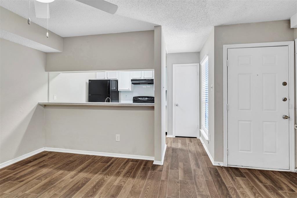 11311 Audelia Road, Unit 271 Dallas, TX 75243 - Photo 2 of 17 Dining area with bar/pass through into kitchen