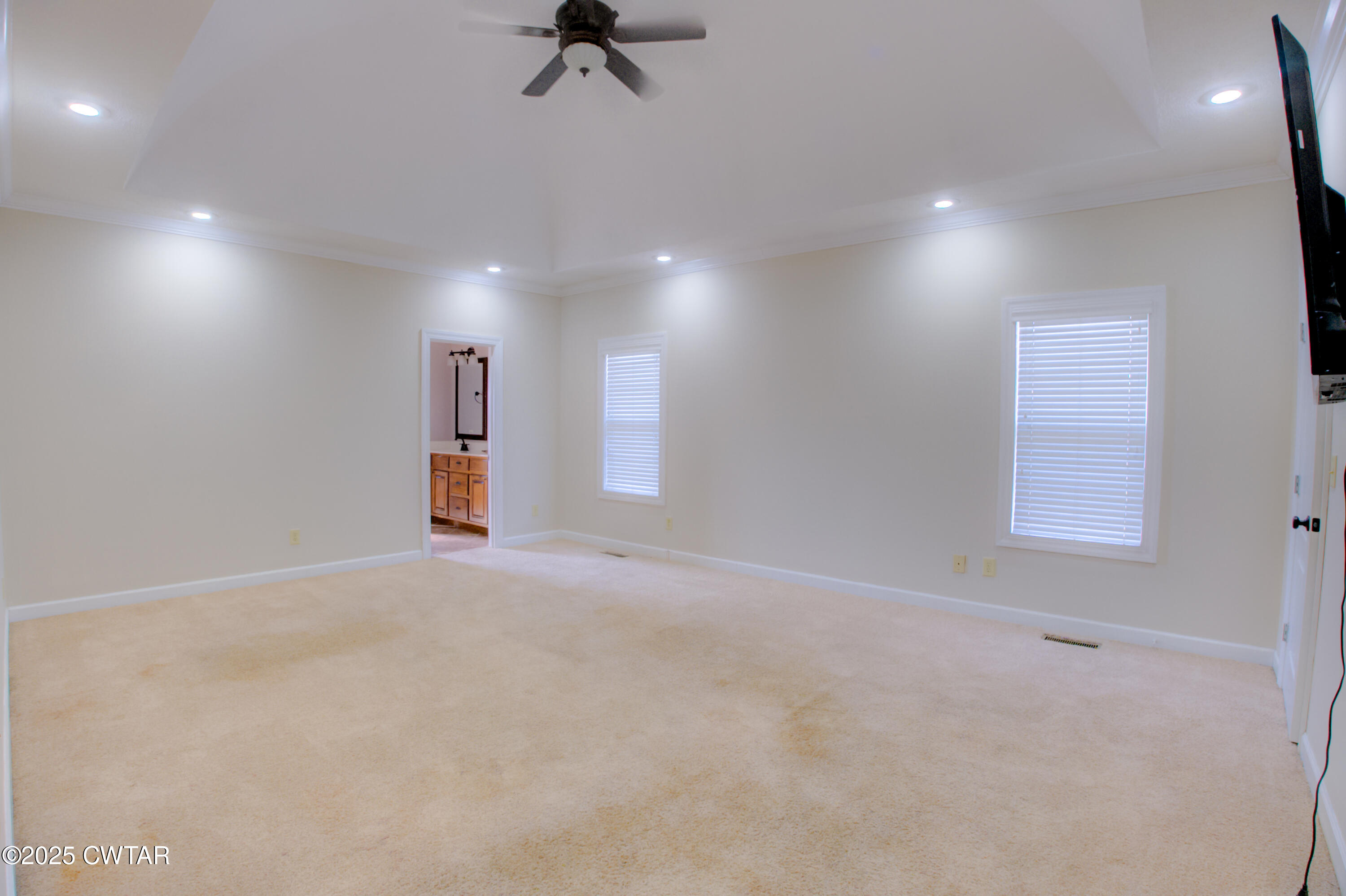 135 Fox Run Cove Henderson, TN 38340 - Photo 11 of 21 an empty room with a empty space and windows