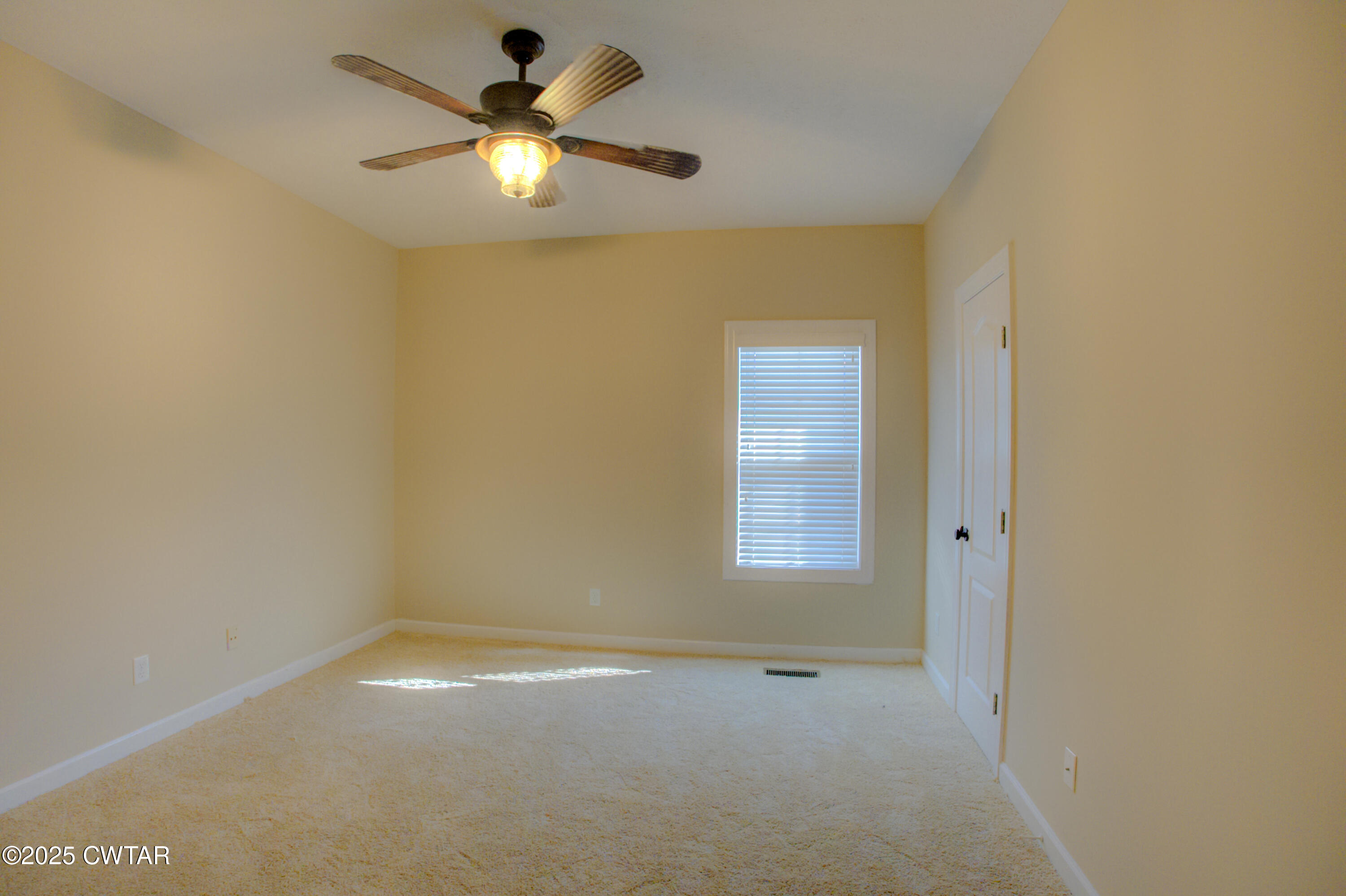 135 Fox Run Cove Henderson, TN 38340 - Photo 16 of 21 a view of an empty room with a window