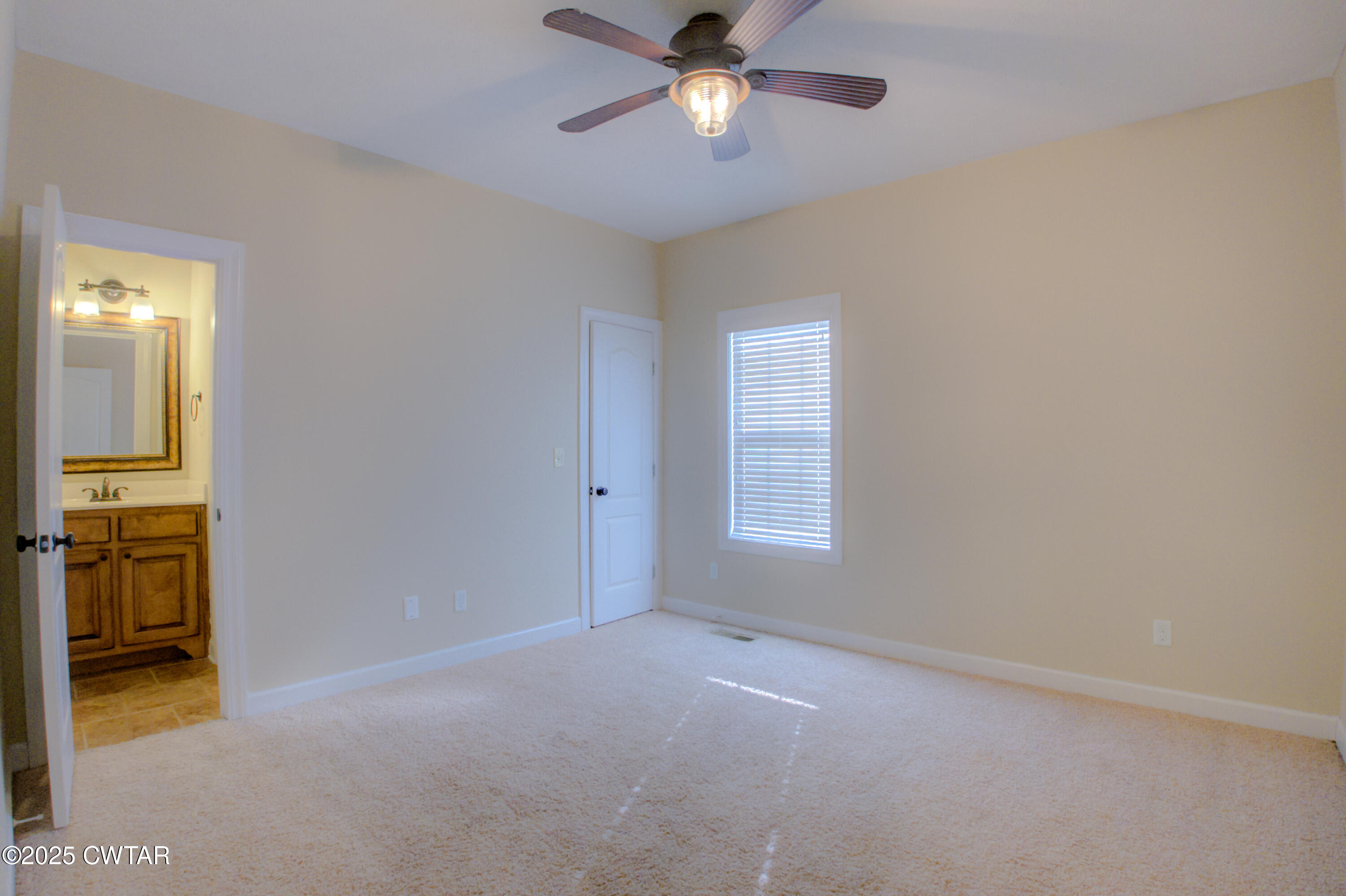 135 Fox Run Cove Henderson, TN 38340 - Photo 18 of 21 a view of an empty room with a window