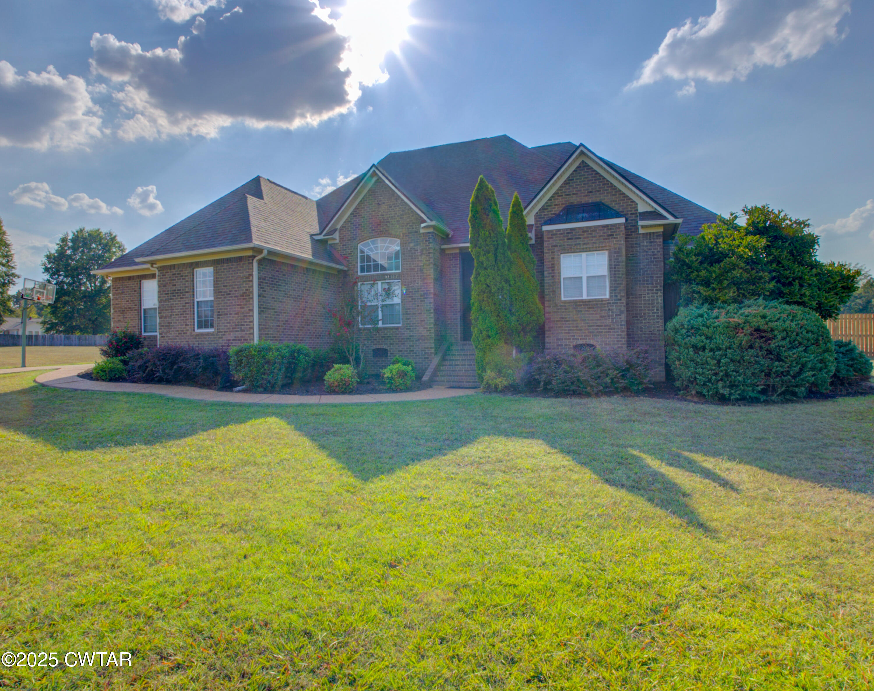 135 Fox Run Cove Henderson, TN 38340 - Photo 2 of 21 a front view of a house with yard and green space
