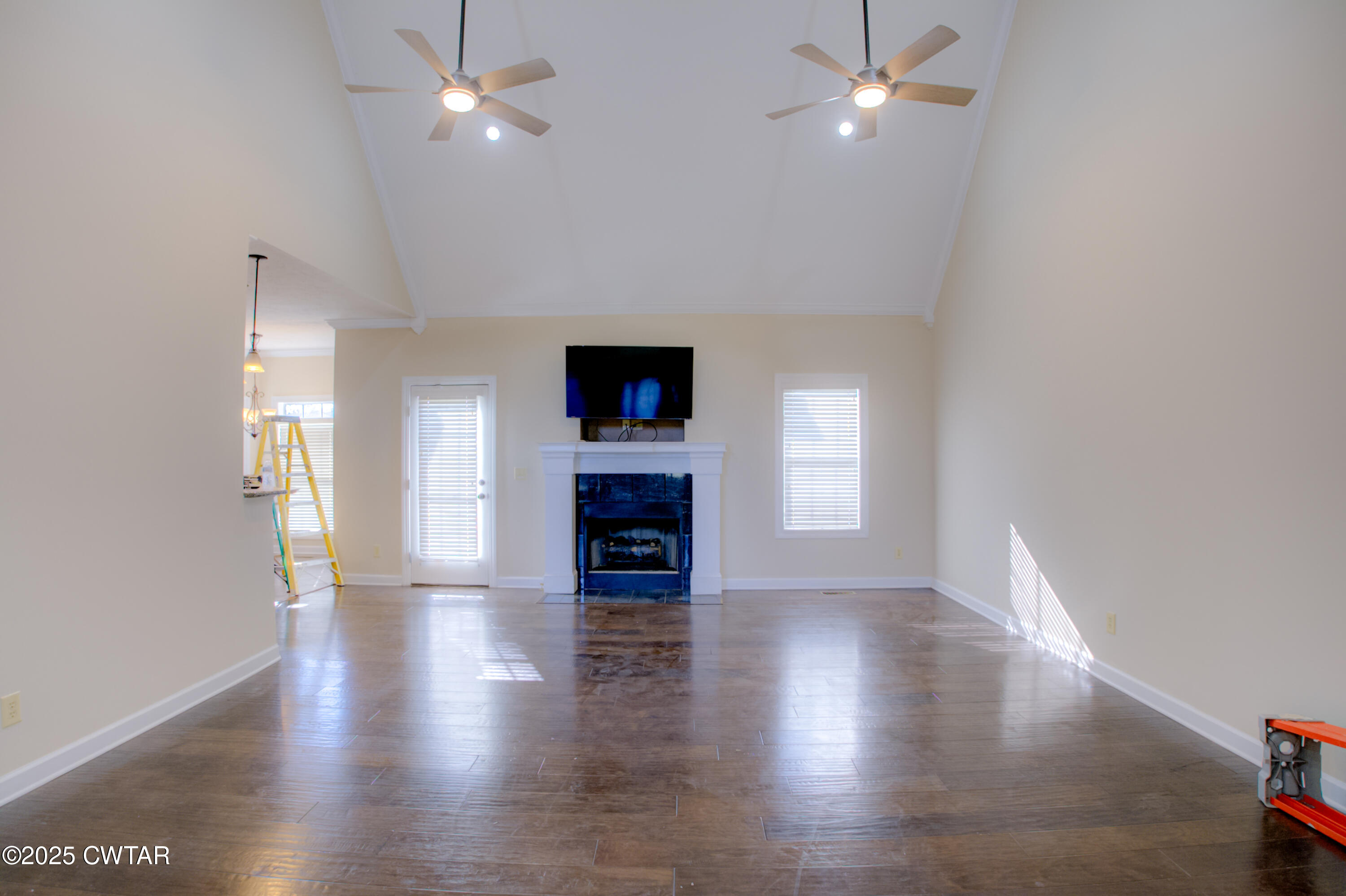 135 Fox Run Cove Henderson, TN 38340 - Photo 4 of 21 wooden floor in an empty room with a window