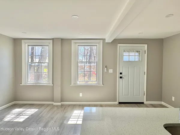 a view of an empty room with a window