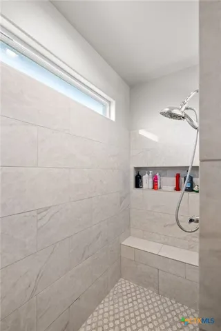 a bathroom with a sink and a shower