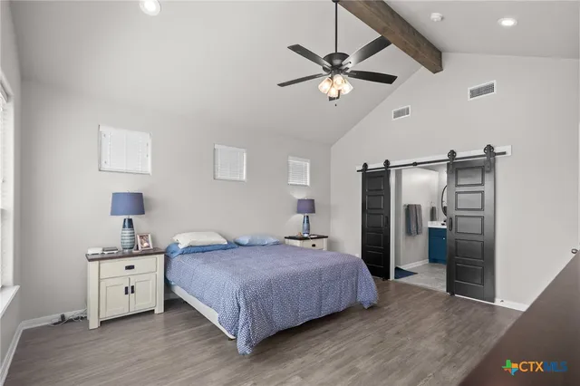 a bedroom with a bed and a walk in closet