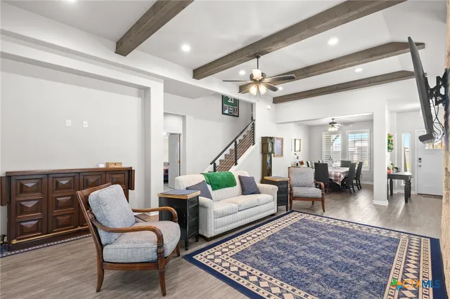 a living room with furniture and a rug