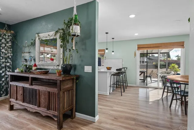 a kitchen with stainless steel appliances white cabinets and a sink