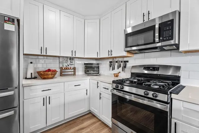 a dining room with furniture window and wooden floor