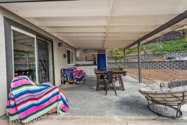 a view of a chairs and table in a patio