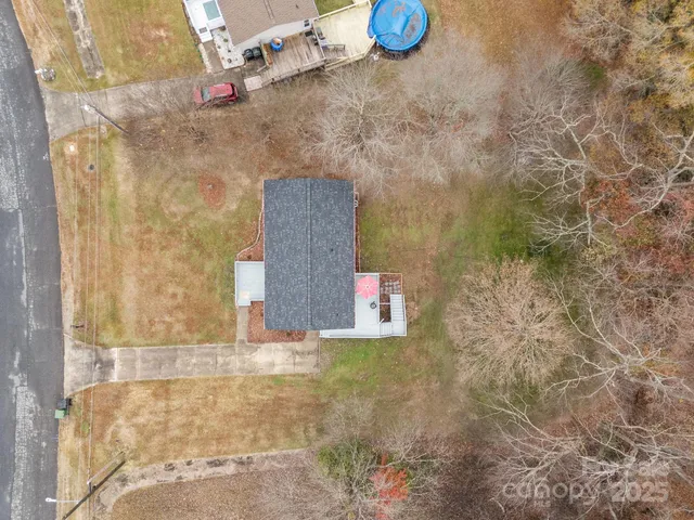 a view of a swimming pool with a yard
