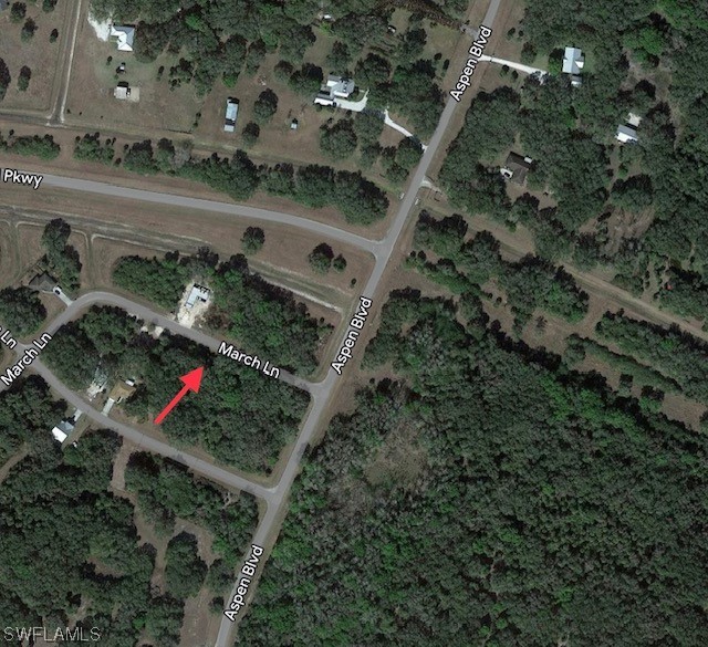 4 March Lane LaBelle, FL 33935 - Photo 2 of 7 an aerial view of a house with a yard