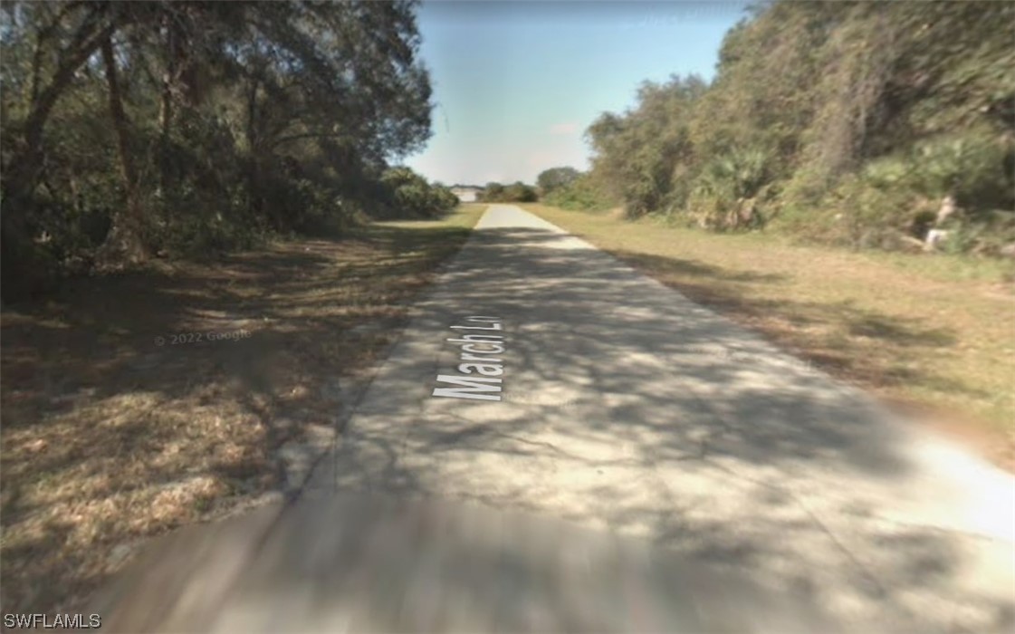 4 March Lane LaBelle, FL 33935 - Photo 5 of 7 a view of a yard with a tree