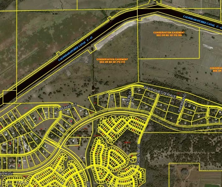 4 March Lane LaBelle, FL 33935 - Photo 6 of 7 a blue sign broad on the side of a street