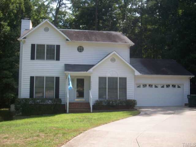 4724 Hunt Manor Court Raleigh, NC 27616 - Photo 1 of 10 a front view of a house with a yard and garage