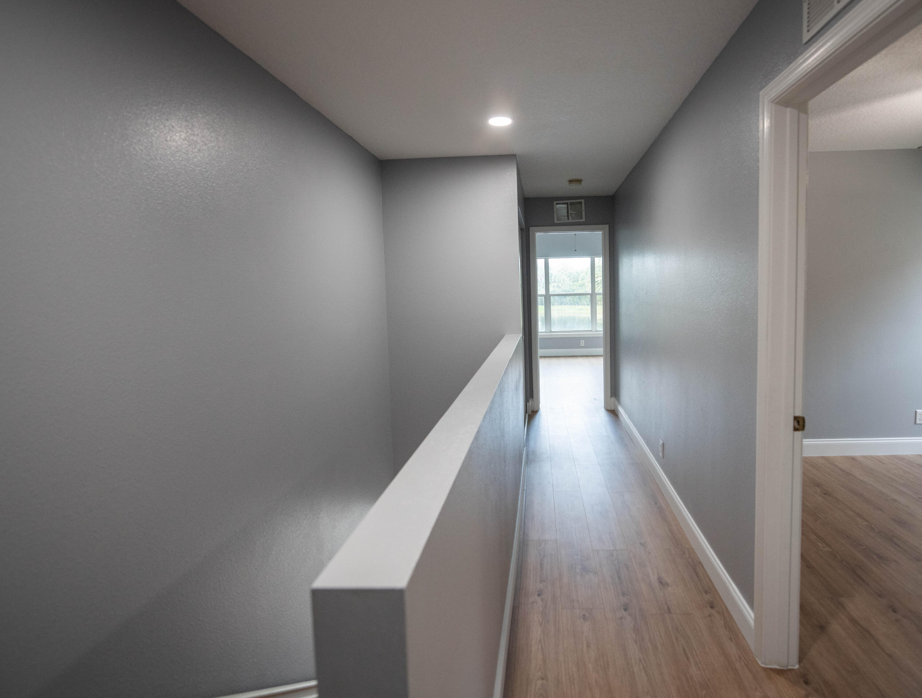 1101 Woodfield Road Greenacres, FL 33415 - Photo 11 of 24 Hallway leading to Master Bedroom