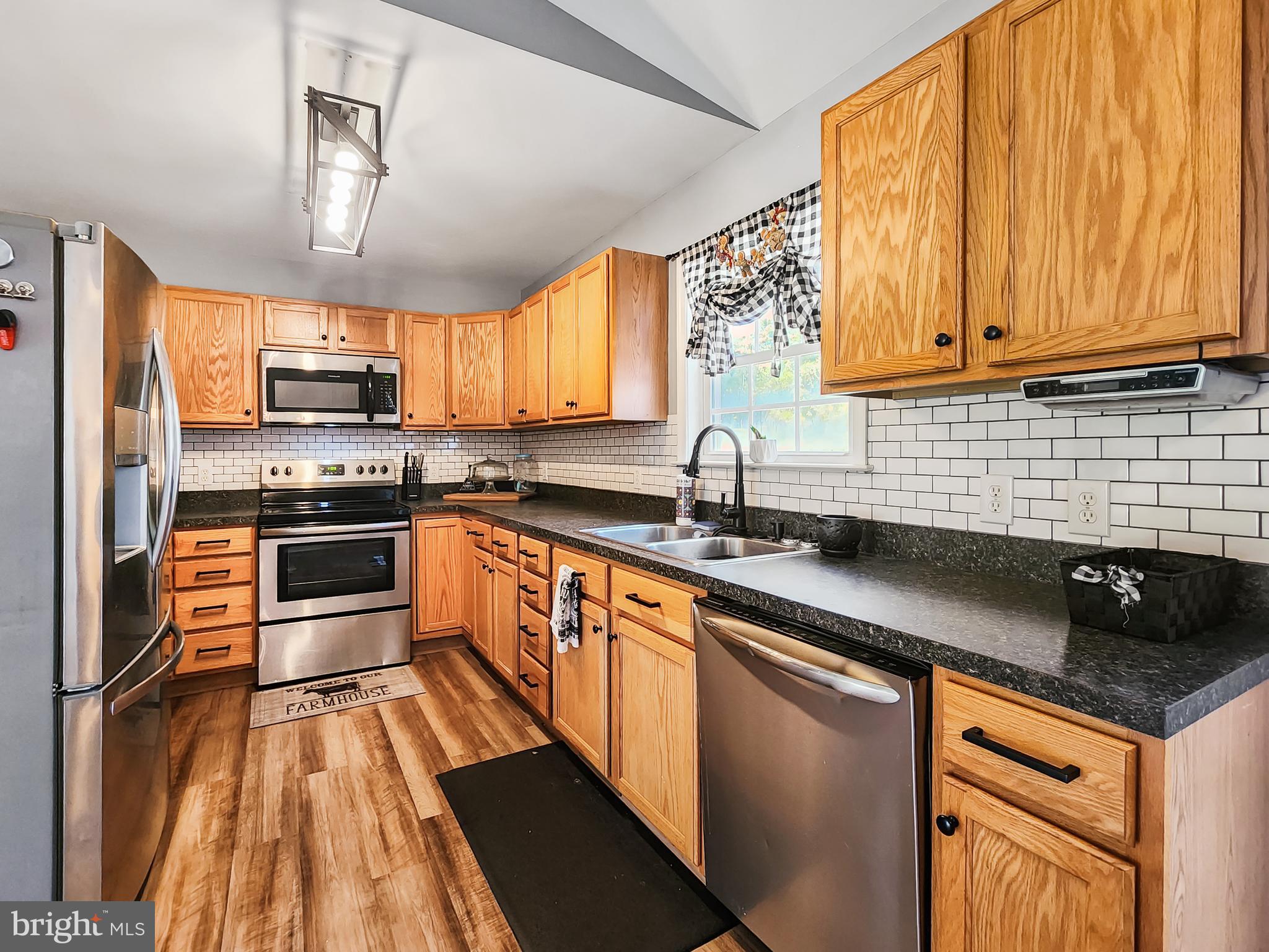 30482 Zion Road Salisbury, MD 21804 - Photo 15 of 39 Cute kitchen with tile backsplash