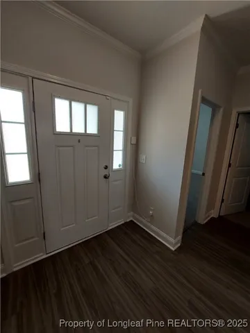 a view of hallway with wooden floor