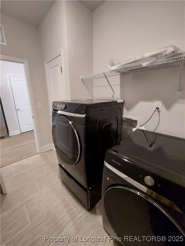 a utility room with dryer and washer