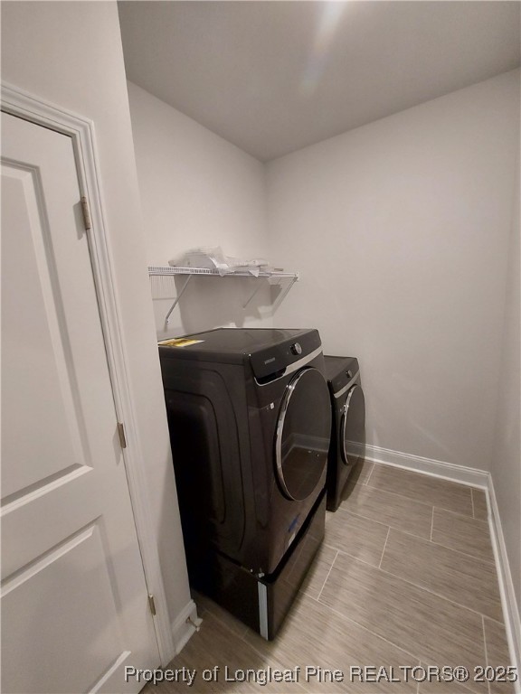 1641 Stackhouse Drive Fayetteville, NC 28314 - Photo 25 of 31 a utility room with dryer and washer