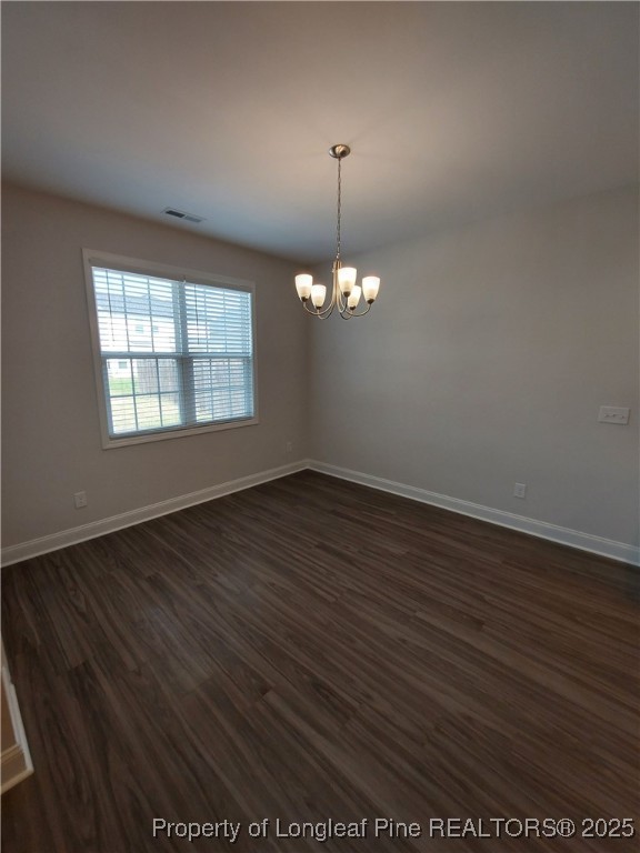 1641 Stackhouse Drive Fayetteville, NC 28314 - Photo 27 of 31 an empty room with wooden floor and windows