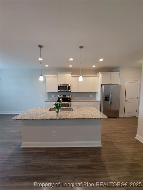 1641 Stackhouse Drive Fayetteville, NC 28314 - Photo 28 of 31 a view of kitchen with kitchen island a counter top space appliances and cabinets