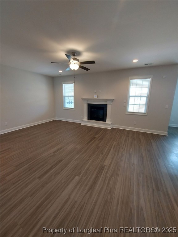 1641 Stackhouse Drive Fayetteville, NC 28314 - Photo 29 of 31 an empty room with wooden floor and windows