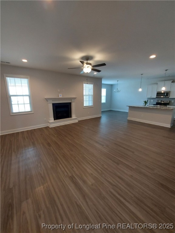 1641 Stackhouse Drive Fayetteville, NC 28314 - Photo 30 of 31 an empty room with wooden floor and windows