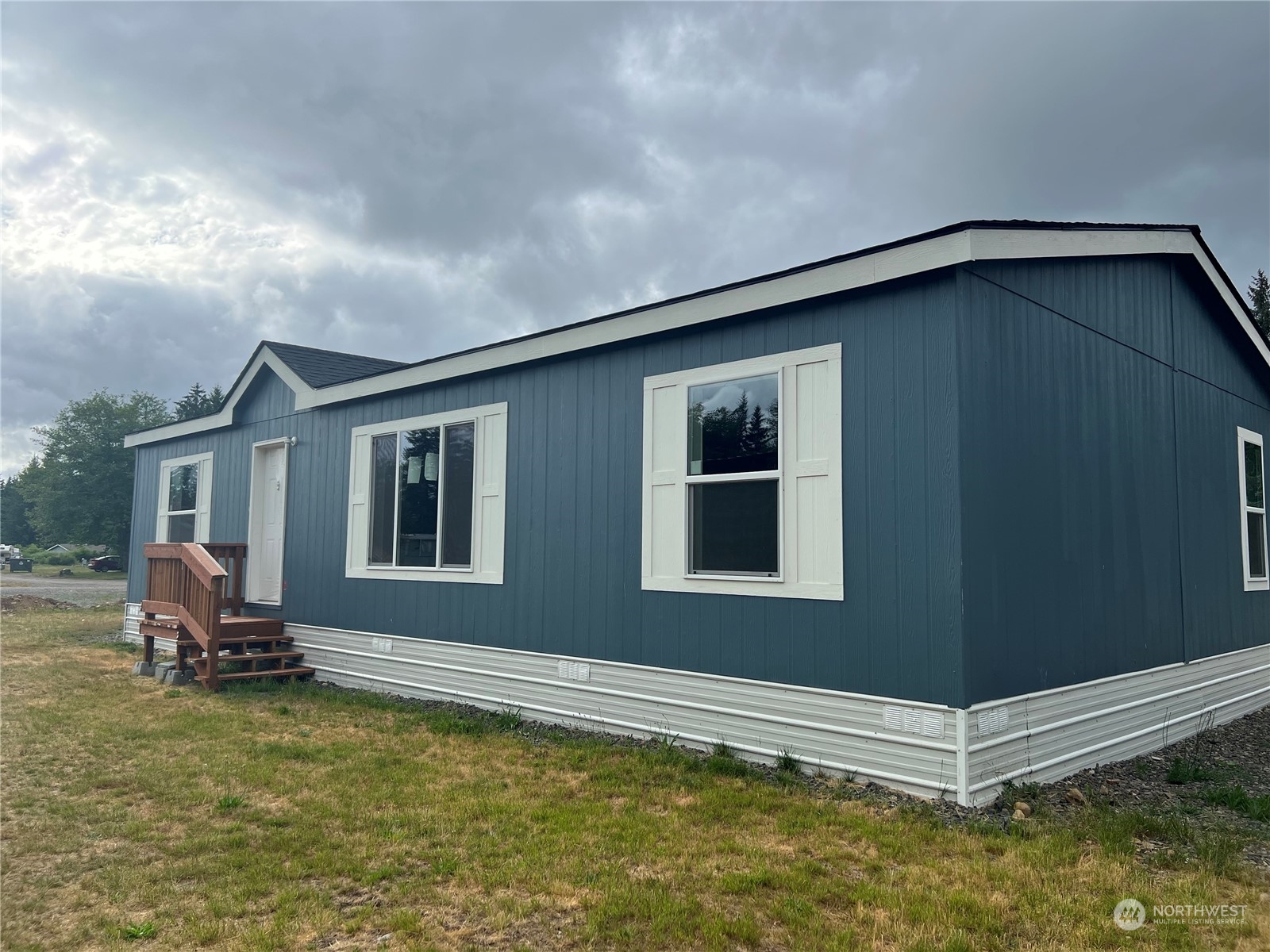 2610 Calawah Way, Unit 44 Forks, WA 98331 - Photo 1 of 12 a view of a house with a yard