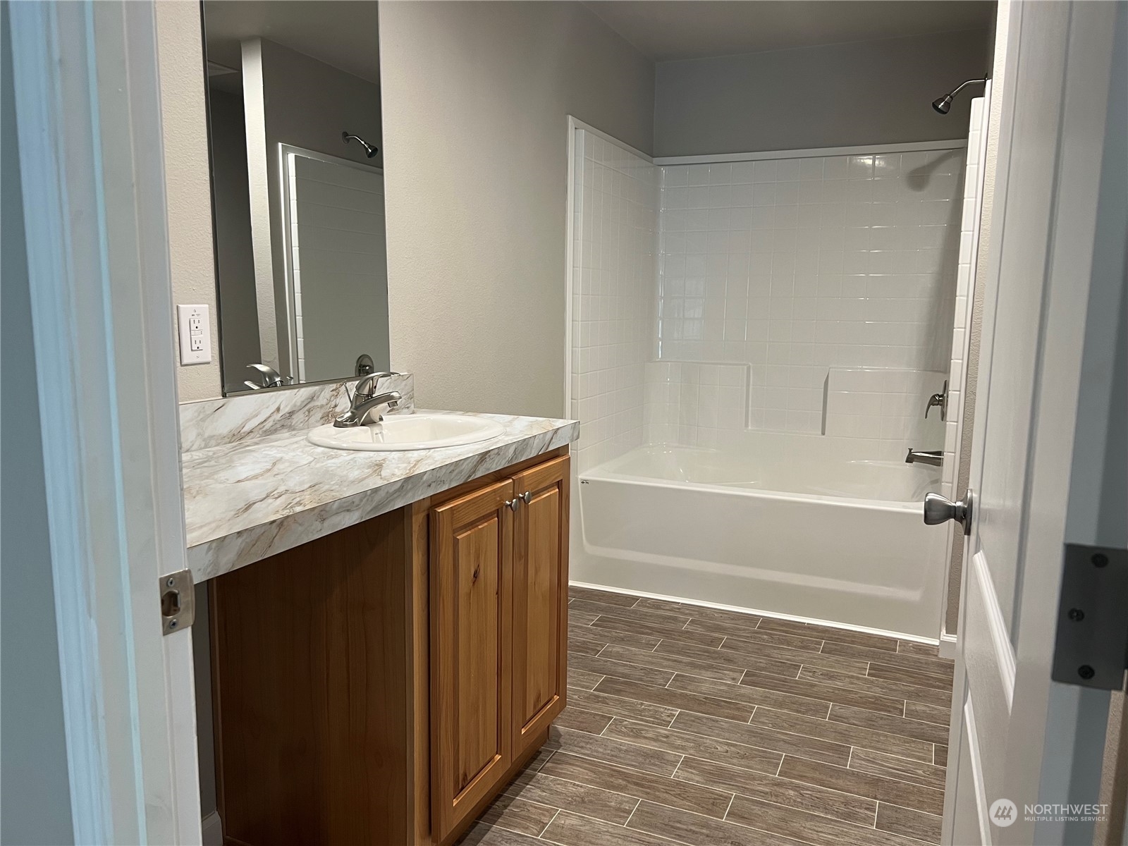 2610 Calawah Way, Unit 44 Forks, WA 98331 - Photo 6 of 12 a bathroom with a granite countertop sink and a mirror