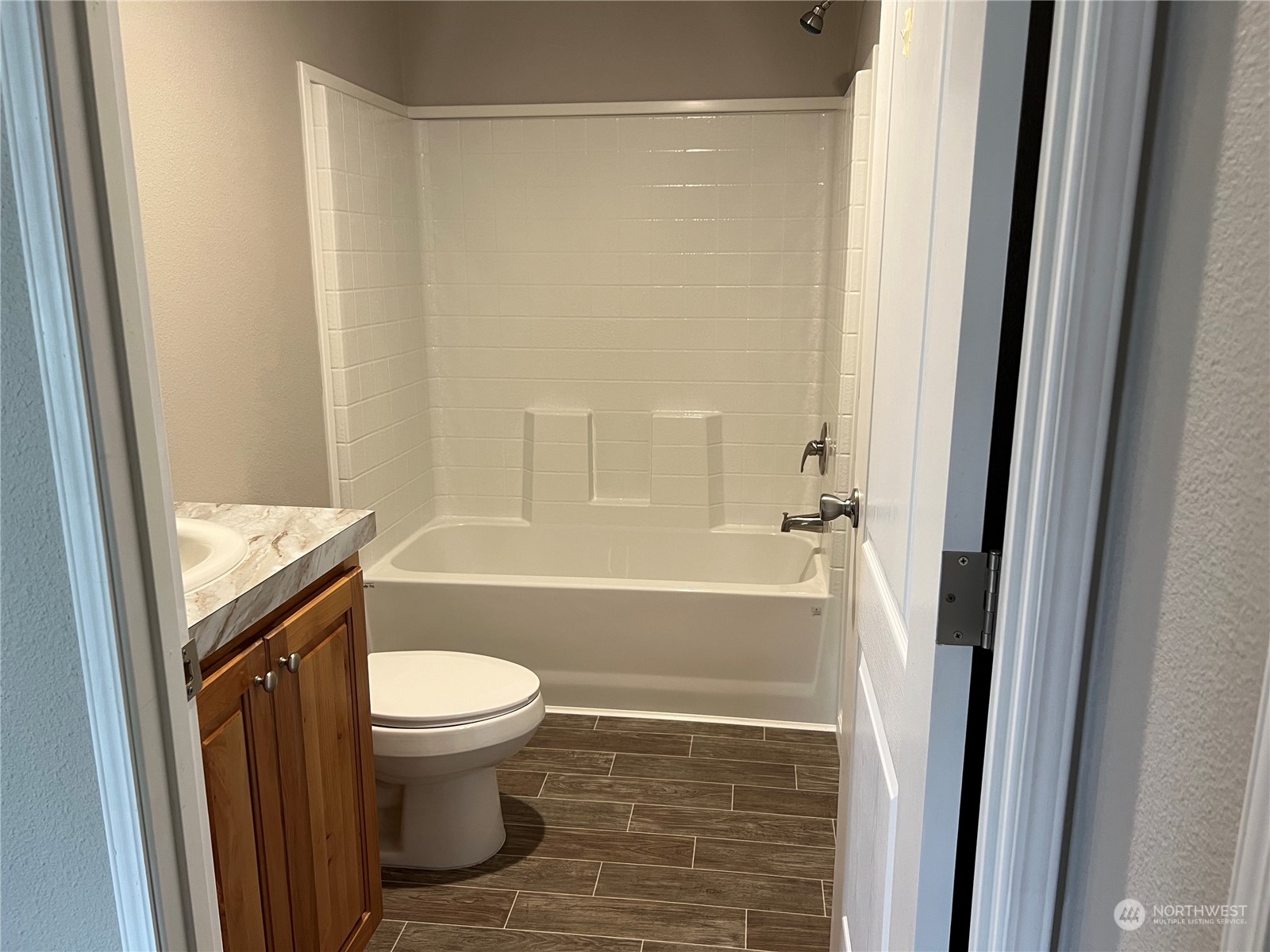2610 Calawah Way, Unit 44 Forks, WA 98331 - Photo 9 of 12 a bathroom with a toilet and a shower